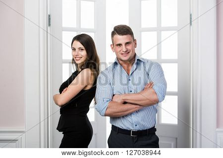 Stylish man in a shirt and a girl in an evening black dress