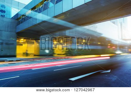 light trails through the footbridge,hongkong china.