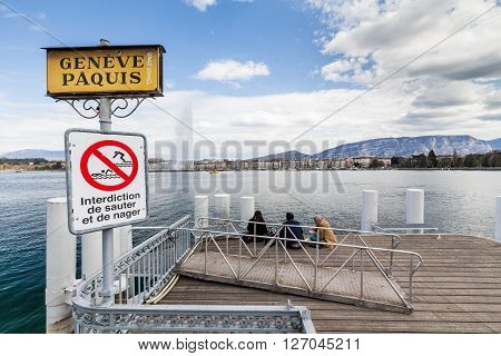 GENEVA, SWITZERLAND - APRIL 11, 2015: Exterior views of the buildings and fountain at the Geneva Lake on April 11 2015. Its the second most populous city in Switzerland (after Zurich).