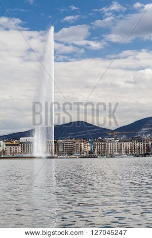 GENEVA, SWITZERLAND - APRIL 11, 2015: Exterior views of the buildings and fountain at the Geneva Lake on April 11 2015. Its the second most populous city in Switzerland (after Zurich).