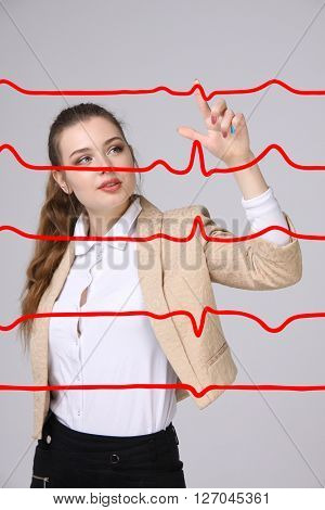 Doctor woman working with cardiogram lines