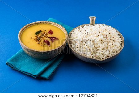 Whole Yellow Lentil with Rice, dal tadka and jeera rice, Indian Dish, cooked rice and cooked Arhar or Toor dal (Pigeon Pea), served in ceramic bowl