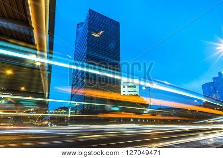 light trails through the footbridge,hongkong china.