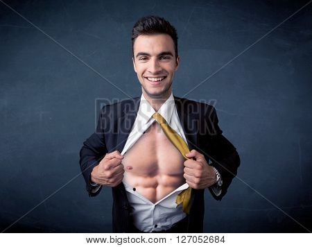 Businessman tearing off his shirt and showing mucular body concept on background