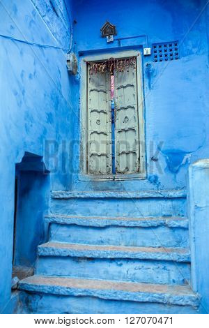 Classic door, stairs and wall in Blue City Jodhpur, India.
