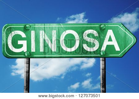Ginosa road sign, on a blue sky background