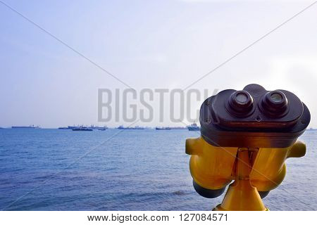 yellow binocular for sightseeing at the sea