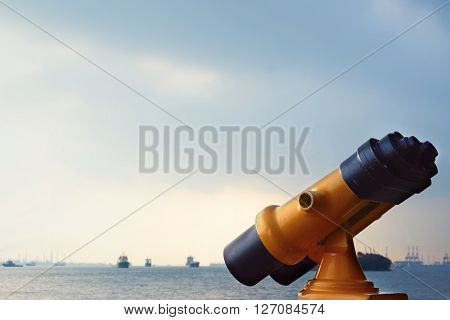 yellow binocular for sightseeing at the sea