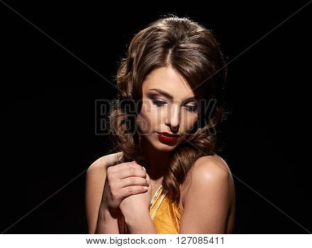 woman studio portrait in hollywood style light on black background with space