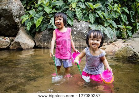 Asian Little Chinese Girls Playing In Creek