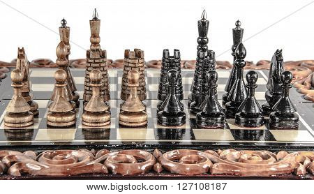 wooden chessboard handmade. woodcarving. game of chess