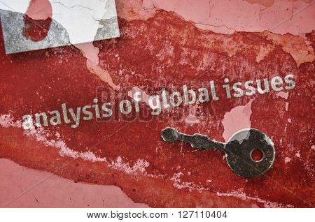 Small key and text Global Issues written on red background