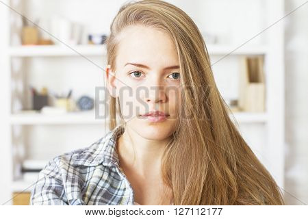 Portrait of beautiful caucasian female with office in the background