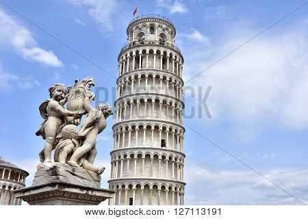 The Leaning Tower of Pisa a wonderful medieval monument one of the most famous landamrk in Italy and the Fontana dei Putti (Fountain with Angels) with city emblem