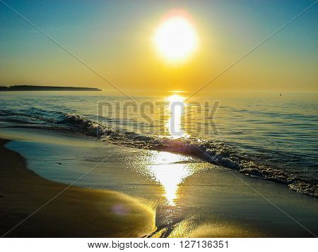 Beautiful golden sundown over the sea. The sunset on the coastline