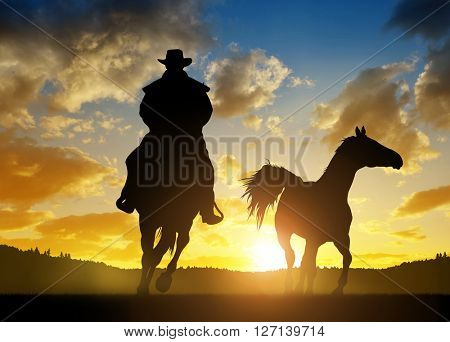 Silhouette cowboy with horse at sunset