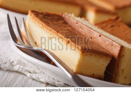 Japanese Cake Kasutera Close-up On A Plate. Horizontal