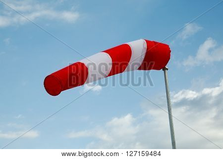 Wind sock against clear blue sky
