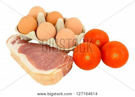 Raw bacon rashers with eggs and tomatoes isolated on a white background