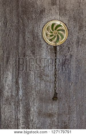 Wooden door vintage peephole, architecture detail. Closeup