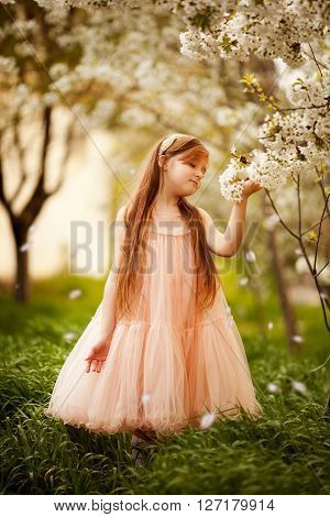 cute little girl in the park in spring