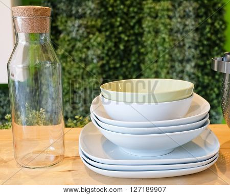 Kitchen Utensil Set of Ceramic Dishes Bowls Plates and Glass Bottles Preparing for Serve Hot and Cold Food.