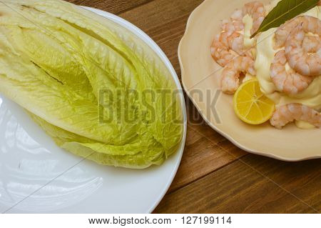prawns, cooked prawns with mayonnaise, whole lettuce on plate