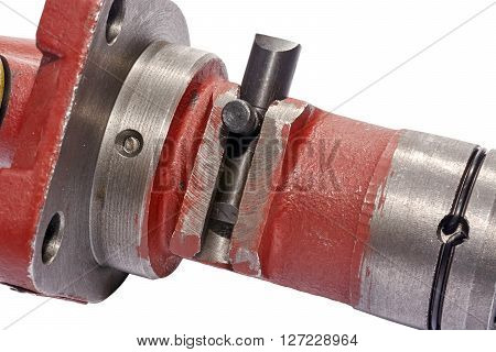 a fragment of a fuel pump in the center of the frame the part regulating the engine speed closeup on white background