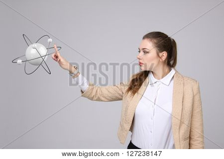 Woman scientist with atom model, research concept