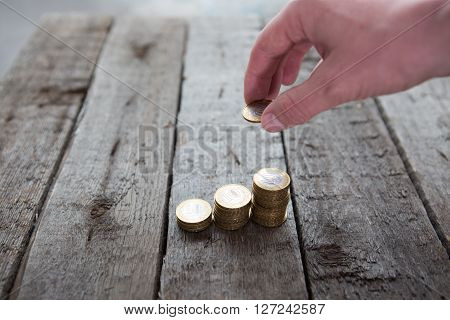 Male Hand Putting Money Coin