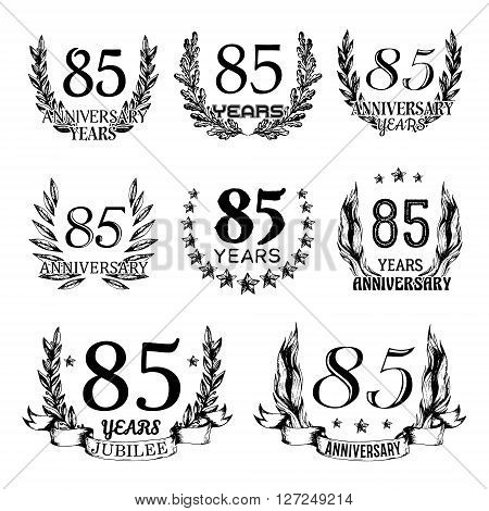 85th anniversary emblems set. Collection of hand drawn anniversary signs with wreath. Celebration badges in sketch style.