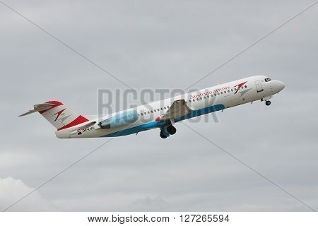 Borispol Ukraine - October 2 2010: Austrian Airlines Fokker 100 passenger plane is taking off into the cloudy sky for a next flight