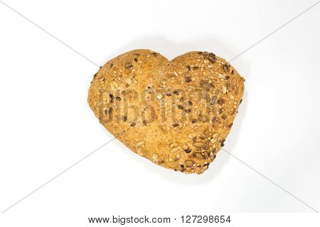 Love for wholemeal bread with seeds of sesame mustard and sunflower on white background