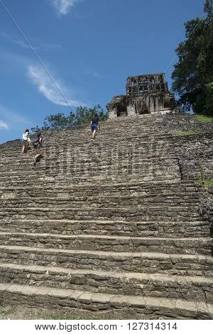 Tourists Climb Stairs At Palenque Site In Mexico