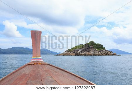 view from nose of long tail boat in a sea to see islands desination way