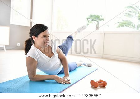 Woman doing workout exercises at home