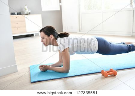 Woman doing workout exercises at home