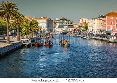 Aveiro Portugal - 22 May 2015: Moliceiro boats sail along the central canal