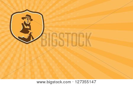 Business card showing illustration of an amish carpenter builder wearing hat holding hammer faciing front set inside shield crest on isolated background done in retro style.