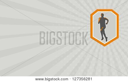 Business card showing illustration of marathon triathlete runner running facing front view set inside shield crest on isolated done in retro style.