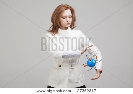 Woman scientist with atom model, research concept