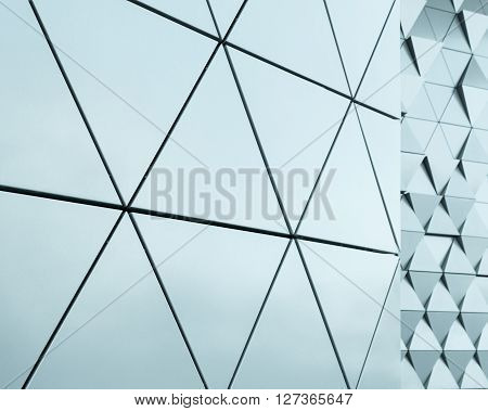Abstract close-up view of modern aluminum ventilated facade of triangles