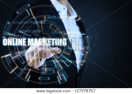 The businessman pointing the blue and orange circle of light by focusing on strategy of online marketing. This picture suitable for business and technology use.