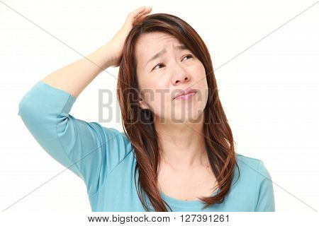 portrait of perplexed woman on white background