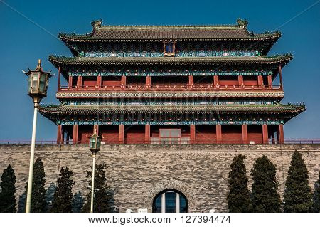 Beijing, China at the Zhengyangmen Gatehouse in Tiananmen Square. Beautiful historical building at sunset.