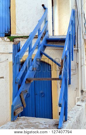 An old wooden blue staircase of color without walking.