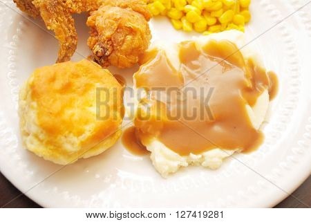 Mashed Potatoes & Gravy with a Biscuit Served as Side Dishes