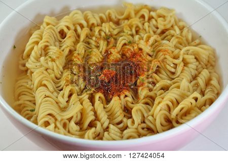 instant noodle parboiled in the white bowl