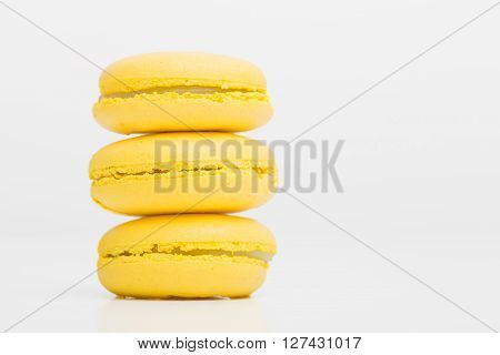 Picture of three yellow macaroons staged on top of each other
