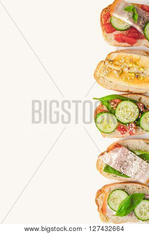 Different tartines on the white background vertical